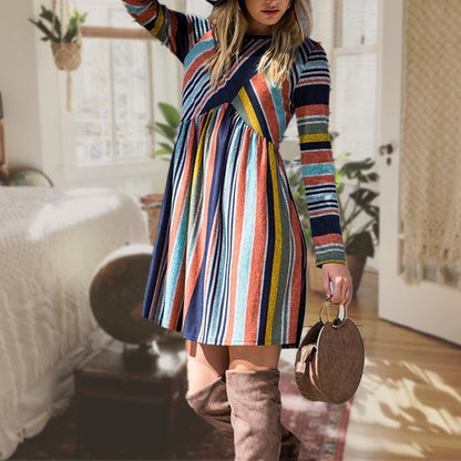 Women's long sleeve knit dress with multi-stripe pattern, A-line skirt, and empire waist.