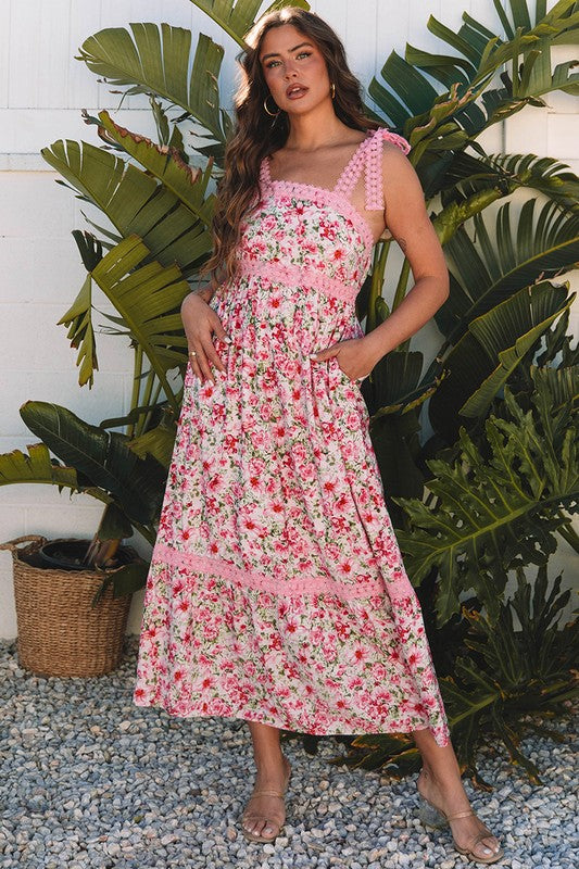 Women's floral print midi sundress with smocked bodice and tie shoulder straps.