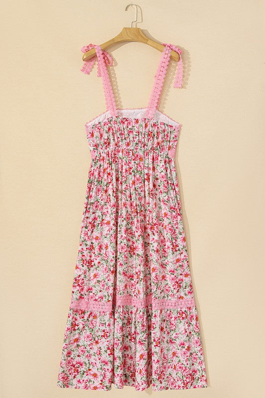 Women's floral print midi sundress with smocked bodice and tie shoulder straps.