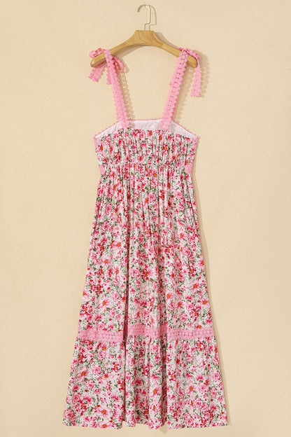 Women's floral print midi sundress with smocked bodice and tie shoulder straps.