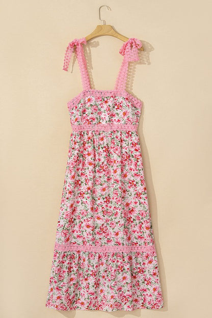 Women's floral print midi sundress with smocked bodice and tie shoulder straps.