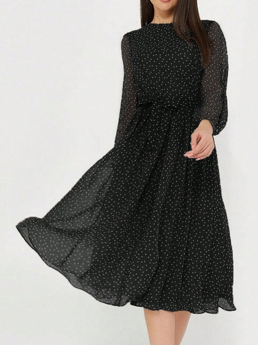 Women's midi dress with polka dot print, sheer long sleeves, and a flowy skirt.