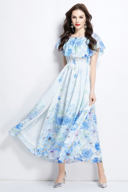 A light blue floral maxi dress with off-shoulder sleeves and a flowing, airy skirt.