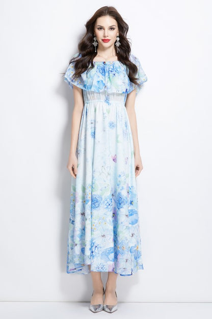A light blue floral maxi dress with off-shoulder sleeves and a flowing, airy skirt.