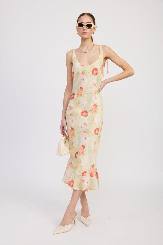 Women's floral print slip dress with adjustable tie shoulder straps and a subtle mermaid hem.