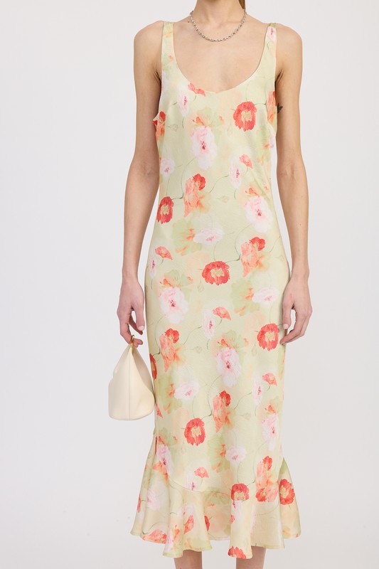Women's floral print slip dress with adjustable tie shoulder straps and a subtle mermaid hem.