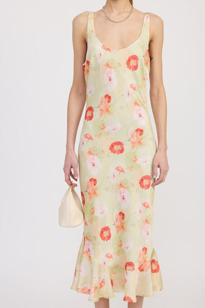 Women's floral print slip dress with adjustable tie shoulder straps and a subtle mermaid hem.