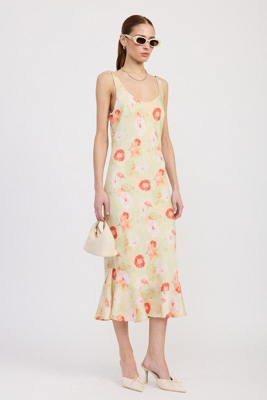 Women's floral print slip dress with adjustable tie shoulder straps and a subtle mermaid hem.
