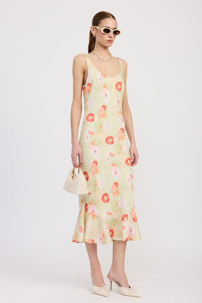 Women's floral print slip dress with adjustable tie shoulder straps and a subtle mermaid hem.