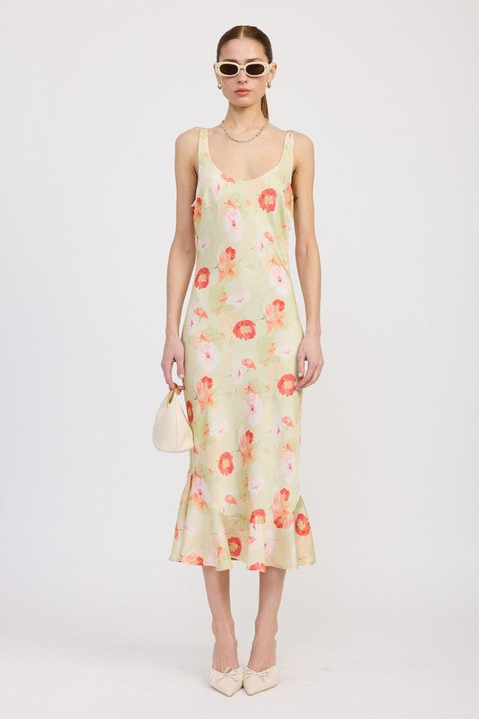Women's floral print slip dress with adjustable tie shoulder straps and a subtle mermaid hem.