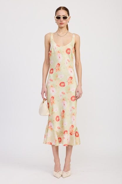Women's floral print slip dress with adjustable tie shoulder straps and a subtle mermaid hem.