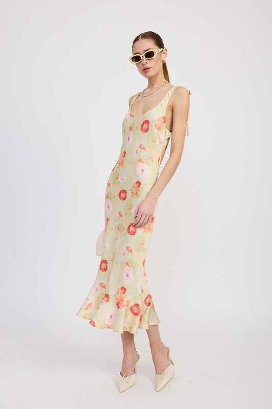 Women's floral print slip dress with adjustable tie shoulder straps and a subtle mermaid hem.