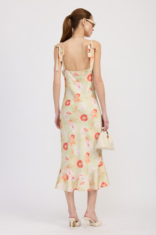 Women's floral print slip dress with adjustable tie shoulder straps and a subtle mermaid hem.