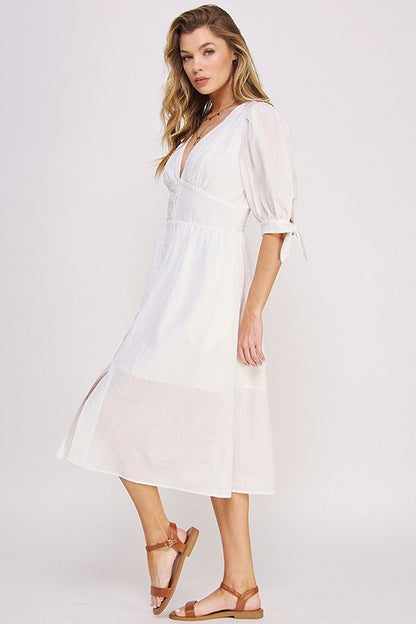 Women's button-front midi dress with V-neck, shirred waist, and 3/4 puff sleeves.