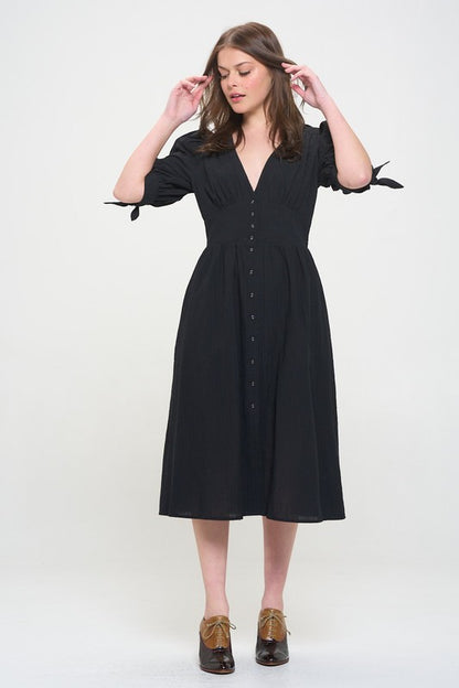 Women's button-front midi dress with V-neck, shirred waist, and 3/4 puff sleeves.