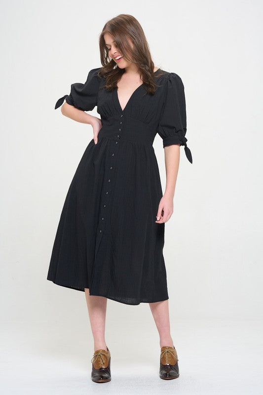 Women's button-front midi dress with V-neck, shirred waist, and 3/4 puff sleeves.