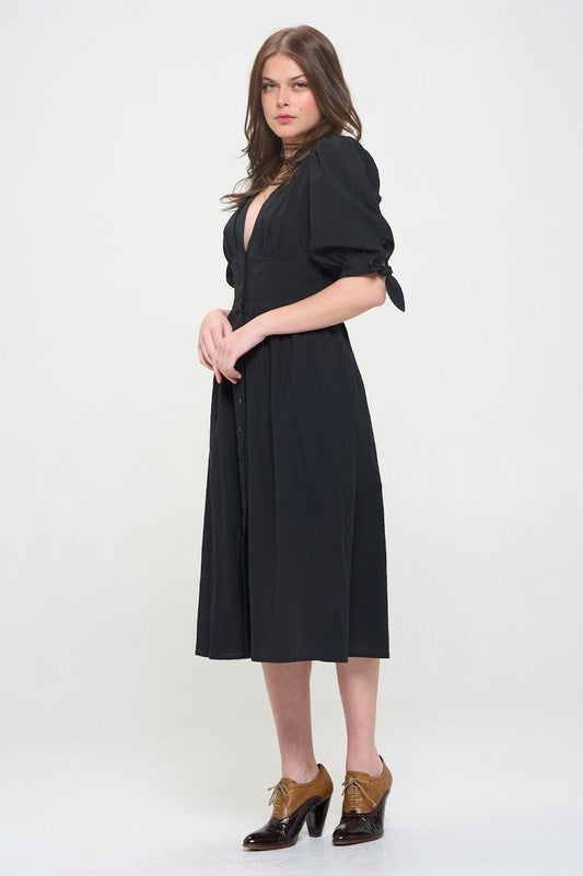 Women's button-front midi dress with V-neck, shirred waist, and 3/4 puff sleeves.
