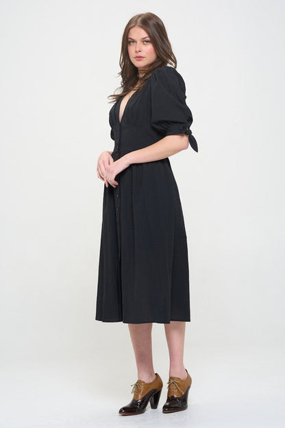 Women's button-front midi dress with V-neck, shirred waist, and 3/4 puff sleeves.