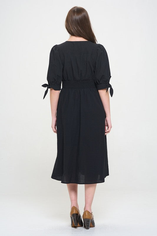 Women's button-front midi dress with V-neck, shirred waist, and 3/4 puff sleeves.
