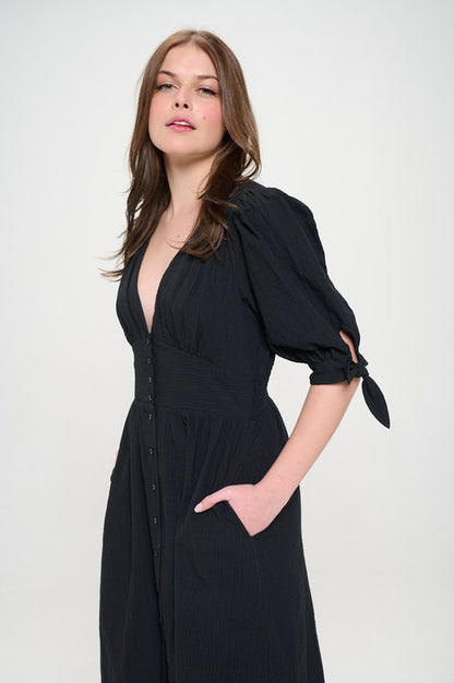 Women's button-front midi dress with V-neck, shirred waist, and 3/4 puff sleeves.