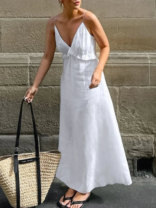 A graceful, floor-length maxi dress featuring a feminine ruffled V-neckline that adds romantic volume and movement to every step.