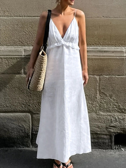 A graceful, floor-length maxi dress featuring a feminine ruffled V-neckline that adds romantic volume and movement to every step.