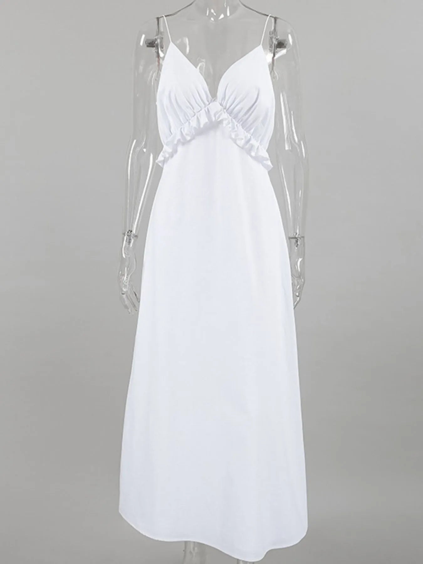 A graceful, floor-length maxi dress featuring a feminine ruffled V-neckline that adds romantic volume and movement to every step.