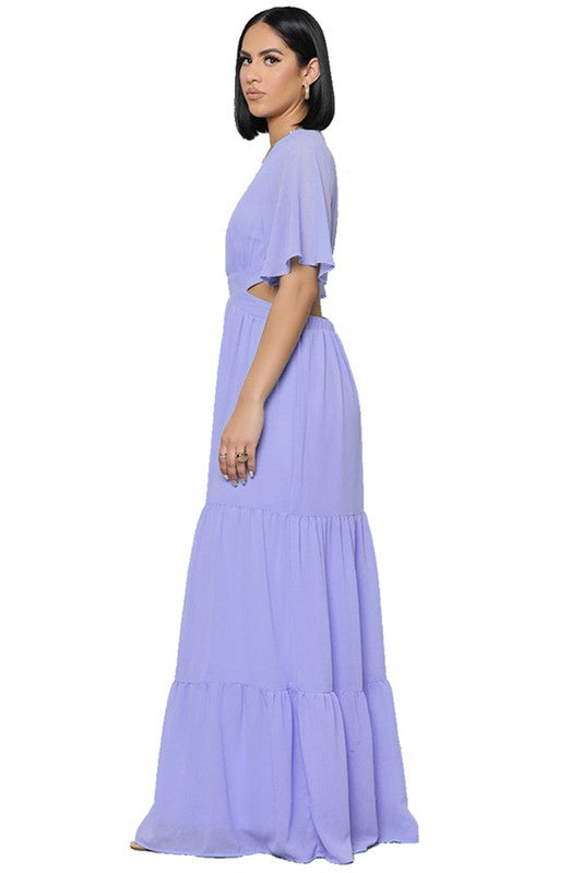 The sexy chiffon maxi dress features a flowing silhouette, delicate sheer fabric, and a flattering, figure-skimming fit that drapes gracefully from neckline to hem for an effortlessly alluring look.