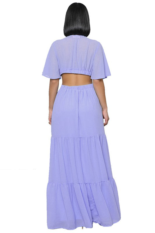 The sexy chiffon maxi dress features a flowing silhouette, delicate sheer fabric, and a flattering, figure-skimming fit that drapes gracefully from neckline to hem for an effortlessly alluring look.