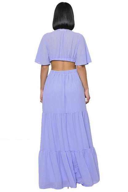 The sexy chiffon maxi dress features a flowing silhouette, delicate sheer fabric, and a flattering, figure-skimming fit that drapes gracefully from neckline to hem for an effortlessly alluring look.