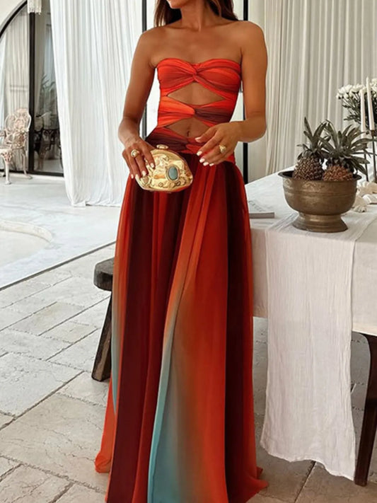 the strapless cut-out rainbow gradient maxi dress features a bold, color-shifting ombre that flows from top to hem, with sleek silhouettes and tasteful cut-outs for a daring, statement-making look