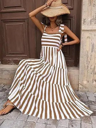 the striped and floral sleeveless maxi dress features a flowing silhouette that combines bold stripes with delicate floral accents for a chic, summery look.

