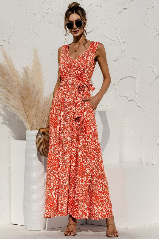 The tie-detail maxi dress features a flowing silhouette accentuated by adjustable tie details at the bodice and waist, creating a flattering, breezy look perfect for warm-weather occasions.