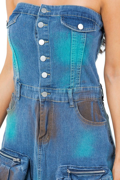 Close up of Women’s strapless denim maxi dress with button-front closure, front slit, and oversized utility pockets. 