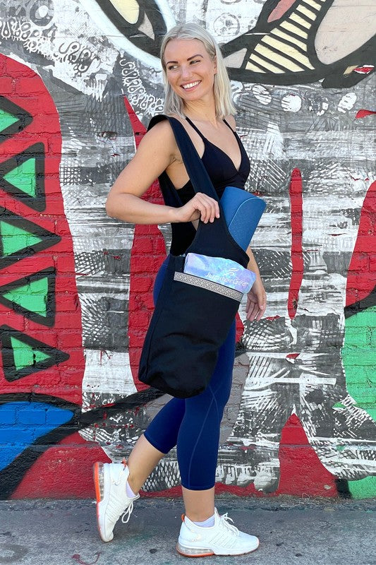 Upgrade your yoga game with the Yoga Mat Tote Bag featuring Large Side Pockets—a sleek, spacious solution for yogis who like to stay organized. Whether you're heading to the studio, the park, or a weekend retreat, this tote keeps your mat secure and your essentials close.