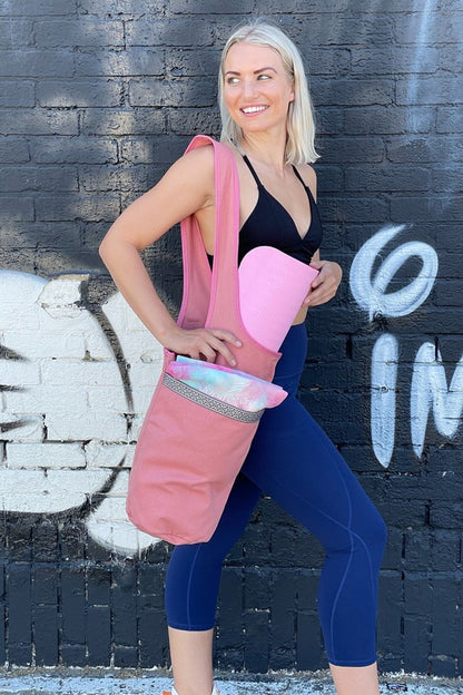 Upgrade your yoga game with the Yoga Mat Tote Bag featuring Large Side Pockets—a sleek, spacious solution for yogis who like to stay organized. Whether you're heading to the studio, the park, or a weekend retreat, this tote keeps your mat secure and your essentials close.