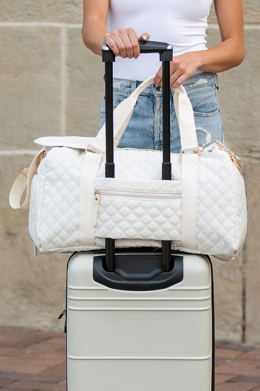 Versatile quilted travel carry-on in a sleek color, offering comfortable and chic transport.