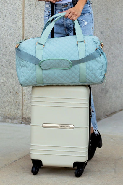 Fashionable light blue quilted weekend bag with a durable design, perfect for short trips.