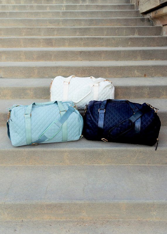 Versatile quilted travel carry-on in a sleek color, offering comfortable and chic transport.