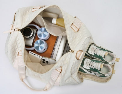 Versatile quilted travel carry-on in a sleek color, offering comfortable and chic transport.