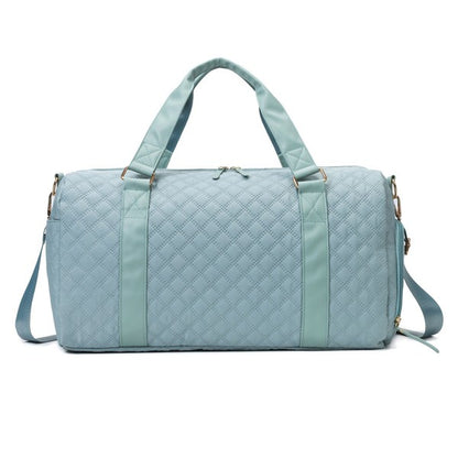 Fashionable light blue quilted weekend bag with a durable design, perfect for short trips.